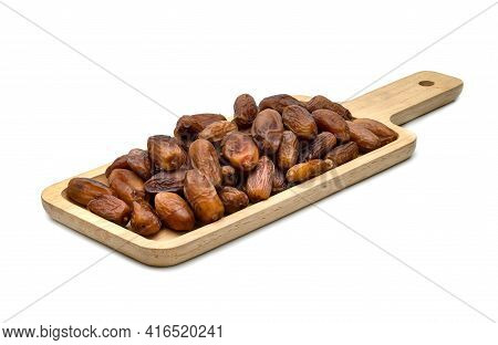 Dry Dates Palm In Wooden Tray Isolated On White Background.