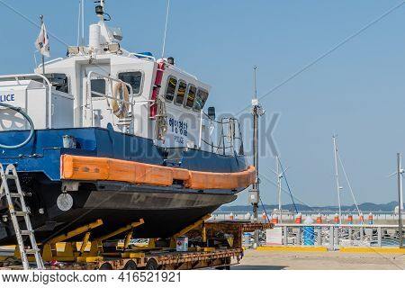 Pyeongtaek, South Korea; April 6, 2021: Side View Of Police Boat On Trailer At Jeongok Port Marina.