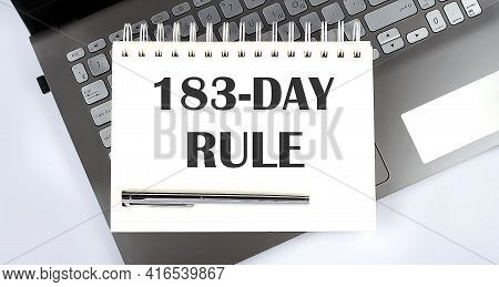 183 Day Rule - Top View Notebook Writing On Laptop