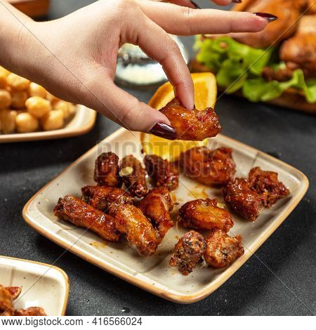 Taking Piece Of The Grilled Chicken Meat Dish