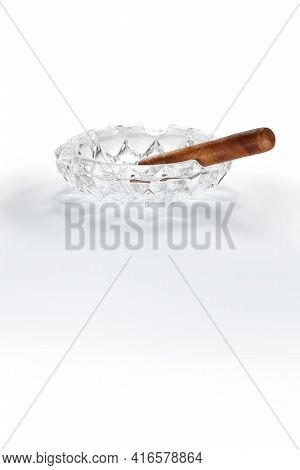 Close Up View Of Nice Robusto Cuban Cigar And Ashtray On White Back