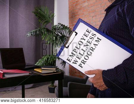 Manager With Employee Wellness Program Ewp Data In The Office.