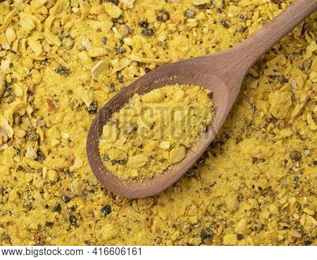 Top View, Closeup Of Lemom Pepper Seasoning On A Wooden Spoon. Food Backdrop.