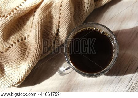 Cup Of Coffee, Scarf On The Wooden Background. Flat Lay, Top View. Neutral Shades.