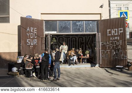 Moscow, Russia - 11 April 2021, A Group Of Young People At The Sur Bar Drink Beer On Ivanovskaya Gor