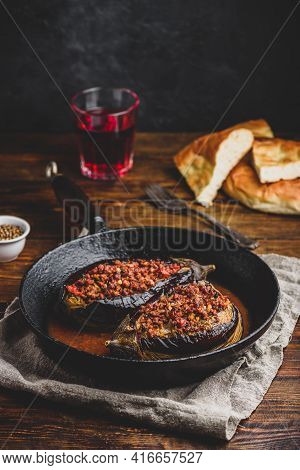 Eggplants Stuffed With Ground Beef, Tomatoes And Spices In Frying Pan. Traditional Dish Karniyarik O