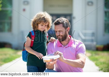 School Boy Going To School With Father. Schoolboy And Parent In Shirt Holding Lunch Box. School Lunc