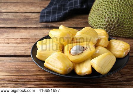 Fresh Exotic Jackfruit Bulbs On Wooden Table