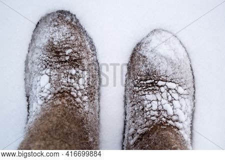 Wea Little Boots In The Snow In Winter