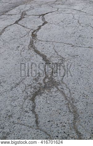 Cracks On The Asphalt On The Road Cracked Coating