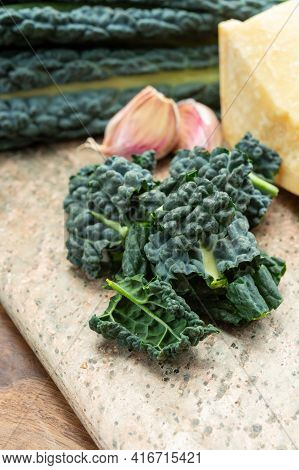 Cooking With Black Flat Leaves Of Cavolo Nero Tuscan Cabbage