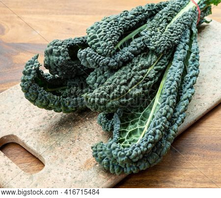 Cooking With Black Flat Leaves Of Cavolo Nero Tuscan Cabbage
