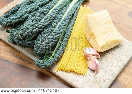 Cooking With Black Flat Leaves Of Cavolo Nero Tuscan Cabbage