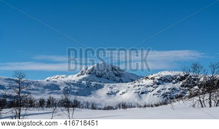 Mount Bitihorn In Norway On A Sunny Winters Day.
