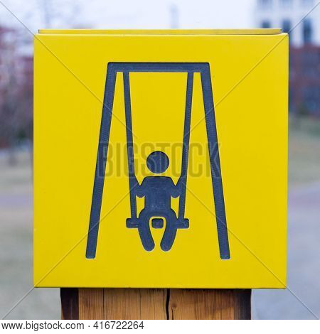 Yellow Sign Of Childrens Playground, Swing. Quality Photo