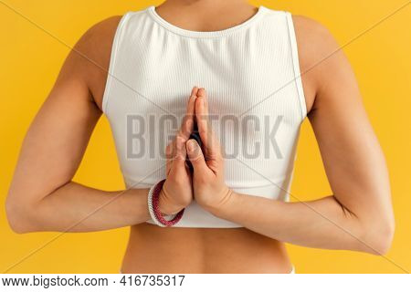 Young Woman Doing Yoga Exercise On Mat In Virasana Or Hero Pose With Reversed Prayer Or Namaste In Y