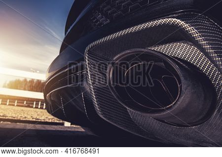 Sport Vehicle Performance Exhaust Close Up. Modern Automotive Theme.