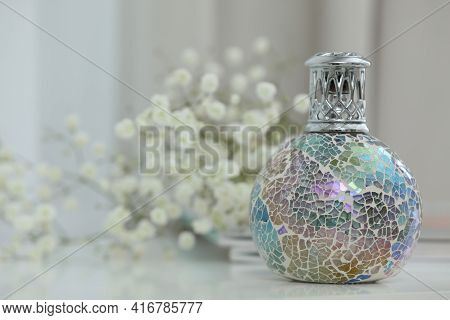 Burning Catalytic Purifying Lamp On Table, Space For Text. Interior Element