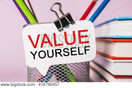 Text Value Yourself On A White Sticker With Office Stationery Background. Flat Lay On Business, Fina