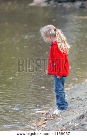 Girl On Riverbank