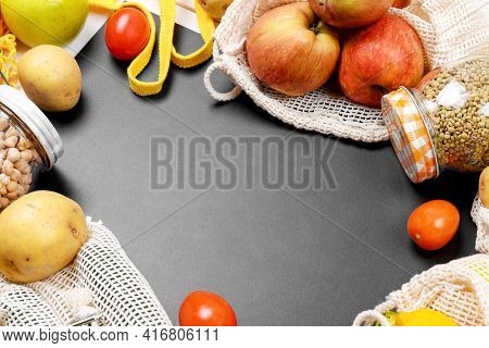 Black Chalkboard And Various Vegetables In A Cotton Eco Sacs, String Mesh Bag And Glass Jar With Leg