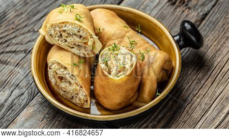 Stuffed Pancakes Or Crepes Rolls With Chicken Meat And Cheese. Traditional Russian Shrovetide Maslen