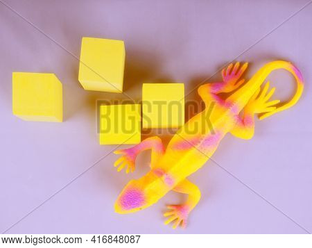Toy Blue Dinosaur, Lizard, Iguana On A Gray Background