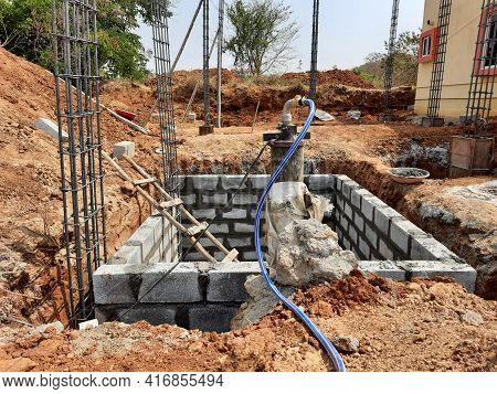 Closeup Of Construction Of Building Indian House With Pillar, Beam, Pit And Water Sump Construct Usi