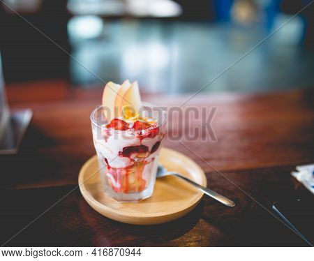 Picture Of A Homemade Fruit Yoghurt With Strawberry Jam, Apple And Conflake