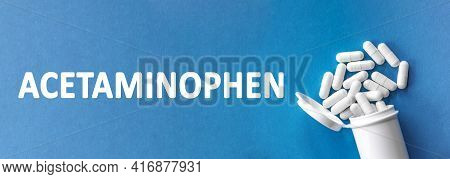 The Word Acetaminophen Is Written Near Pills On A Light Blue Background. Medical, Health And Happine