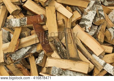 Freshly Cut Birch Firewood. Firewood Background. Pile Of Firewood