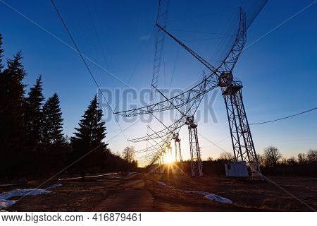 Antenna Array. A Long Row Of Radio Telescopic Antennas At The Sunset