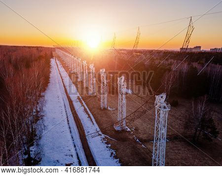 Antenna Array. A Long Row Of Radio Telescopic Antennas At The Sunset