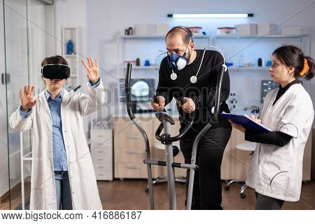 Team Of Scientist Using Virtual Reality Technology