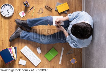 Man writing in notebook noting thinking idea solitions. Student man online larning. Creative inspiration study concept