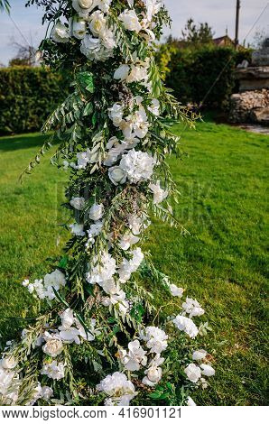 Wedding Arch With Multi-colored Flowers. Wedding Decorations
