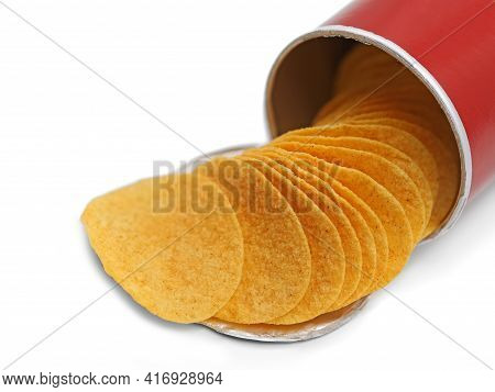 Stacked Crisps Falling Out From Red Cardboard Tube, Paprika Flavoured Potato Chips In Can Isolated O
