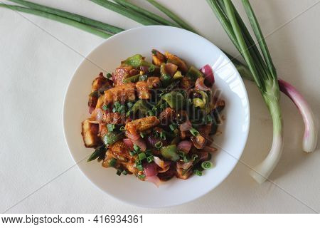 Air Fried Cottage Cheese Cubes And Baby Corn Prepared With Chilli Sauce. It Is An Indo Chinese Dish,