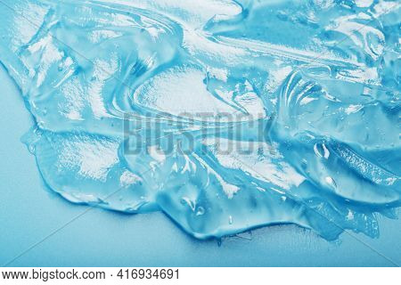 Antiseptic Gel On A Blue Background In Waves.