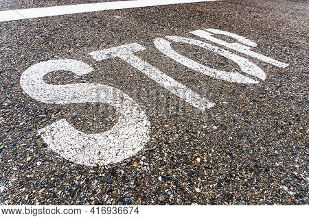 Stop A Large Inscription On The Asphalt In Full Screen