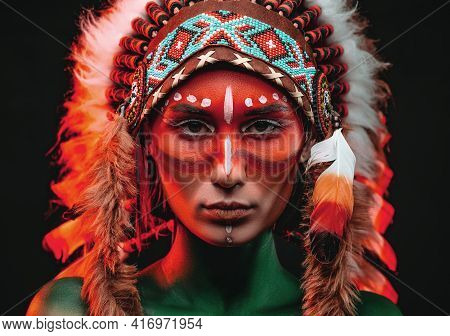 Aboriginal Woman With Painted Skin And Traditinal Indian Headwear