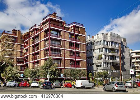 Spain, Barcelona, March, 2021: Modern Architecture And Transport City Traffic With Good Urban Greeni
