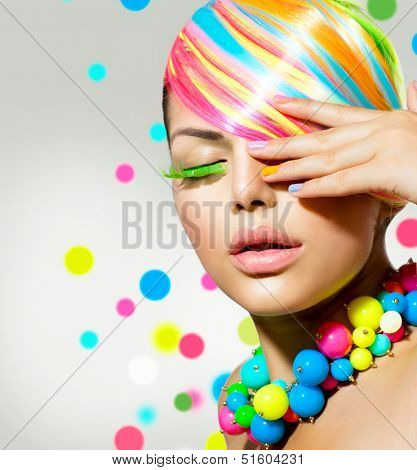 Beauty Girl Portrait with Colorful Makeup, Hair, Nail polish and Accessories. Colourful Studio Shot of Stylish Woman. Vivid Colors. Manicure and Hairstyle. Rainbow Colours 