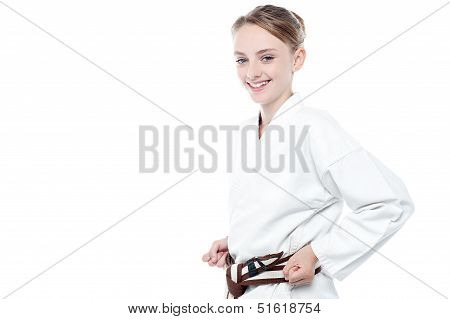 Smiling Karate Girl Isolated Over White