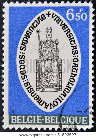 A stamp printed in Belgium shows shield of the Catholic University of Leuven