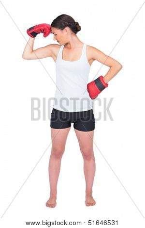 Healthy model with boxing gloves posing on white background