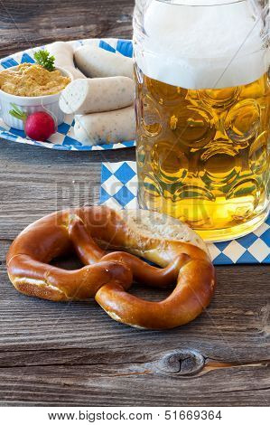 A Large Glass Of Beer And A Pretzel