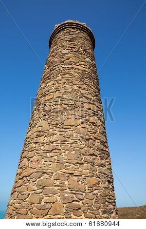 Tall industrial chimney and blue sky