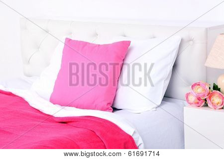 Comfortable soft bed with pillows