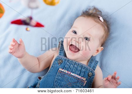 Sweetest Baby Girl Playing With A Colorful Mobile Toy